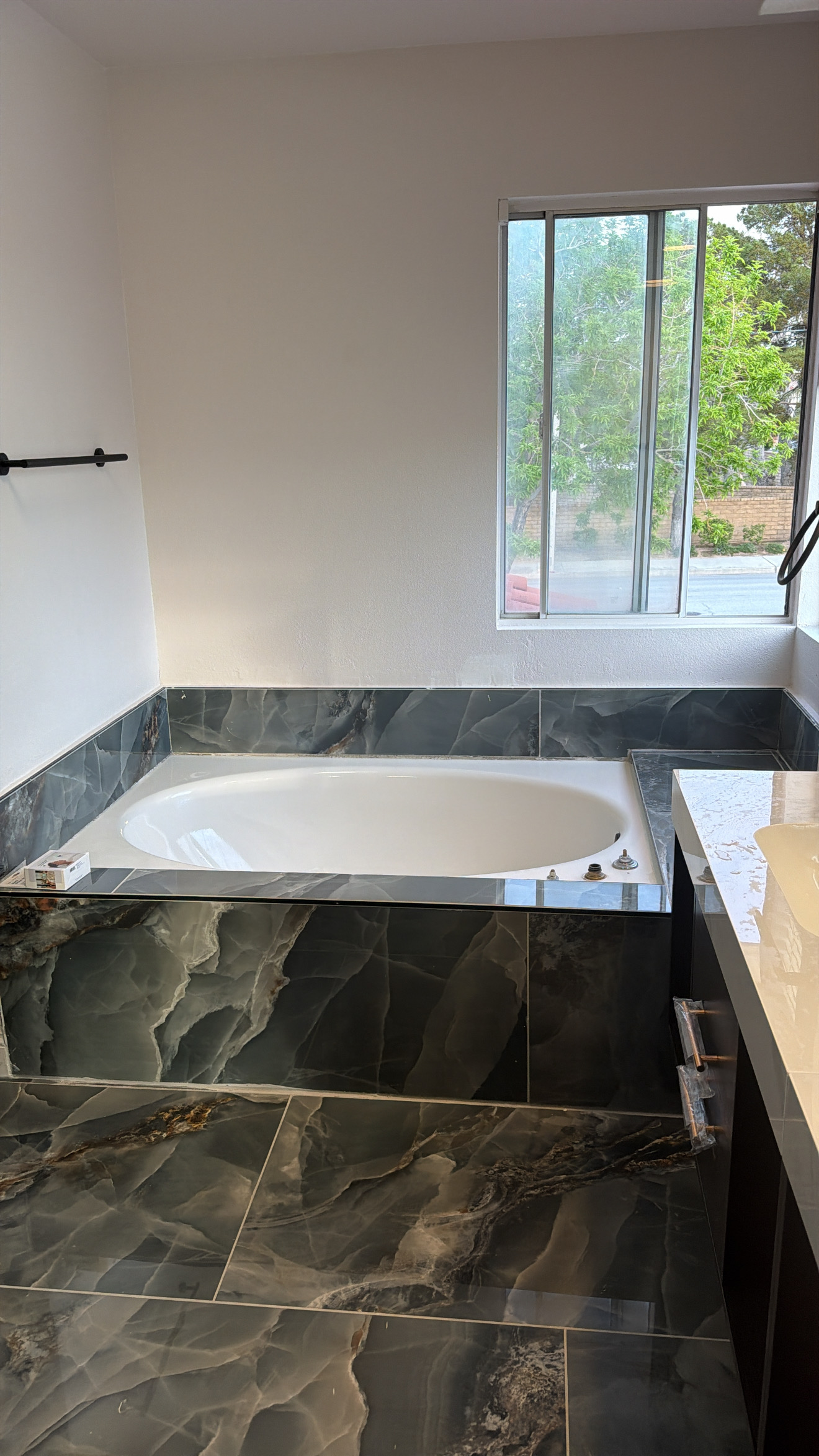 Completed tiled soaking tub surround